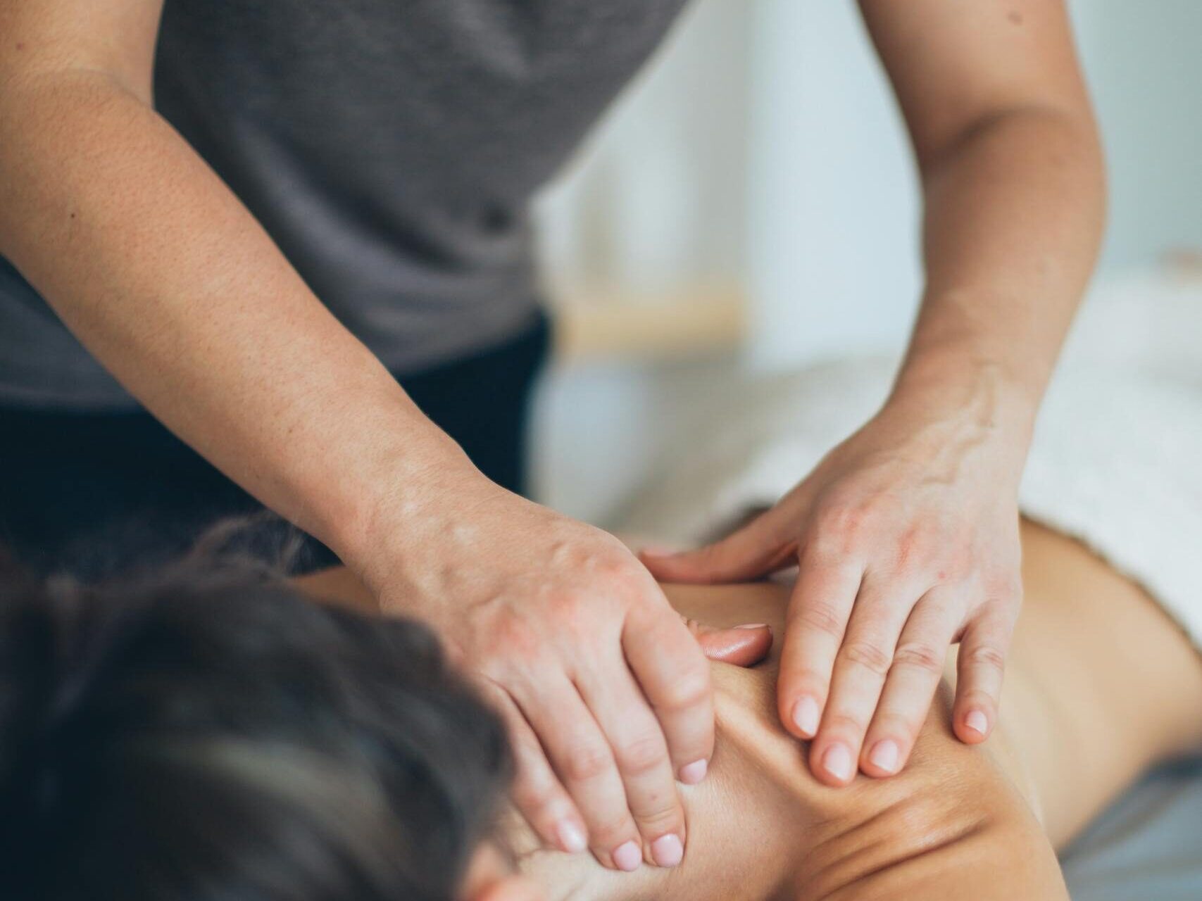 A soothing massage therapy session focused on relaxation and wellness indoors.